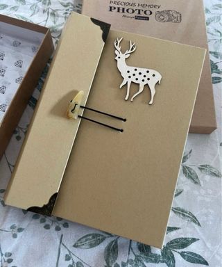 Álbum de fotos con ciervo decorativo
