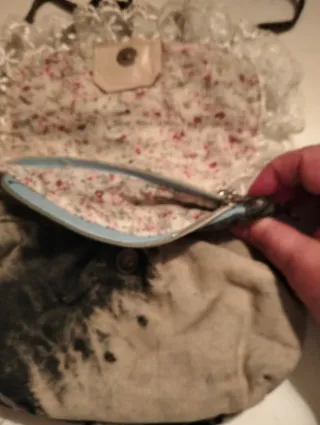 Clutch ganga bege e preto com laço