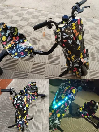 Triciclo eléctrico con luces y música