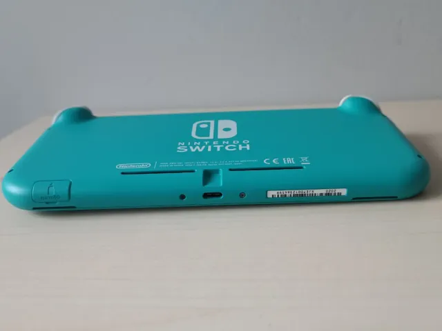 Switch lite magica + 256 gb y juegos