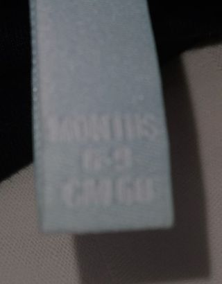 Cappellino bimba Disney nero con fiocco rosa