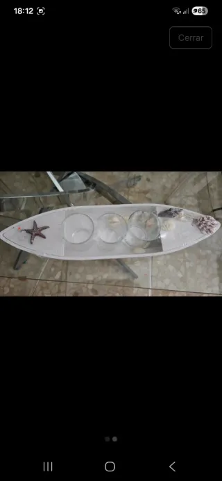 Barco decorativo con conchas y estrella de mar