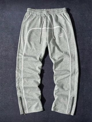 Pantaloni grigi con zip