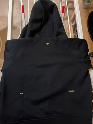 Chaqueta Nike NOCTA Negra y Dorada