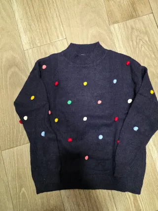 Jersey azul con pompones multicolor