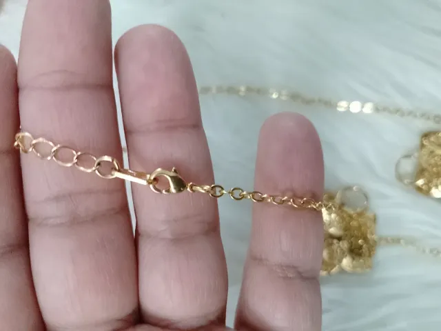 Conjunto collar y pendientes flor dorada