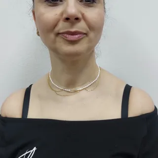 Collana con perle e ciondolo a quadrifoglio