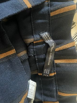 Pantalón Zara rayas negro y dorado