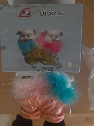 Hucha cerdito con plumas