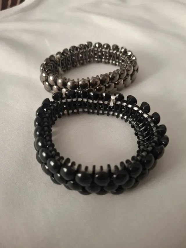 Lote 2 pulseras negras y plateadas elásticas