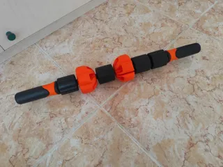 Rodillo de masaje naranja y negro