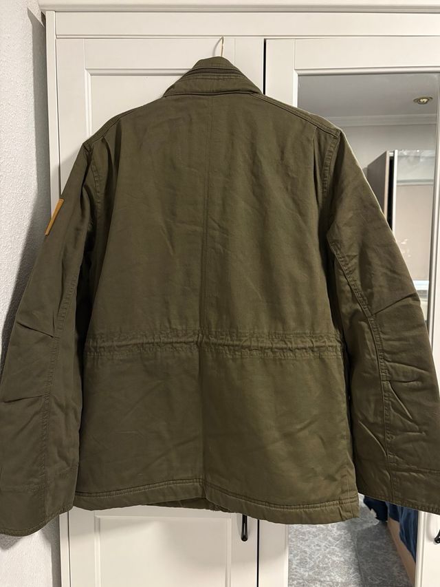 Chaqueta Timberland verde con forro naranja