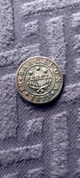 Moneda antigua con laurel