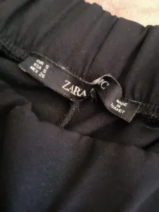 Pantaloni donna neri con righe rosse e bianche