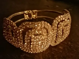 Braccialetto donna strass oro/argento.