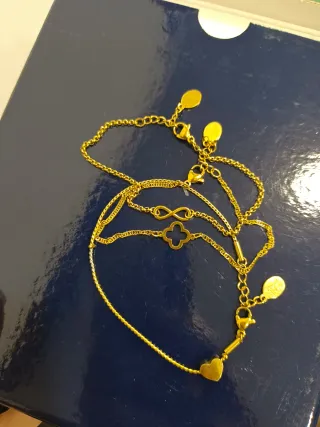 Lote de pulseras doradas