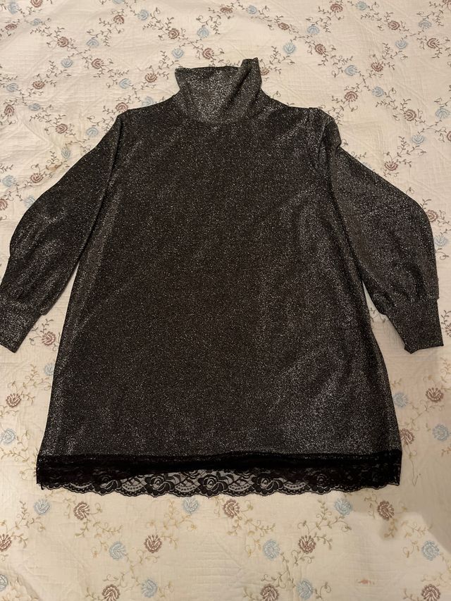 Jersey brillante cuello alto mujer