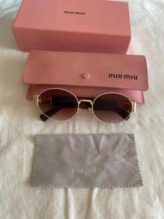 Gafas de sol Miu Miu doradas y marrones