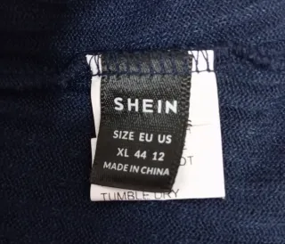 Jersey canalé cuello alto azul