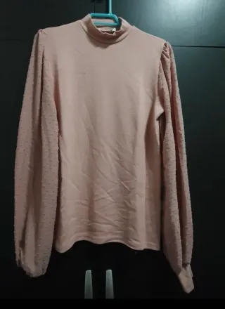 Jersey rosa cuello alto manga abullonada