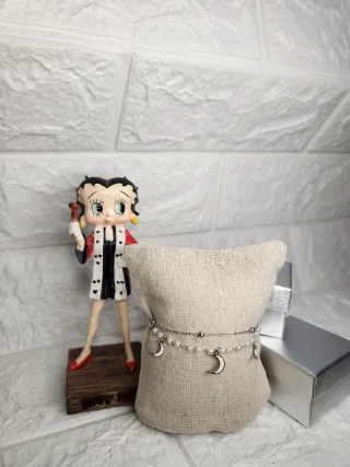 Pulsera de acero con lunas rosas y perlas