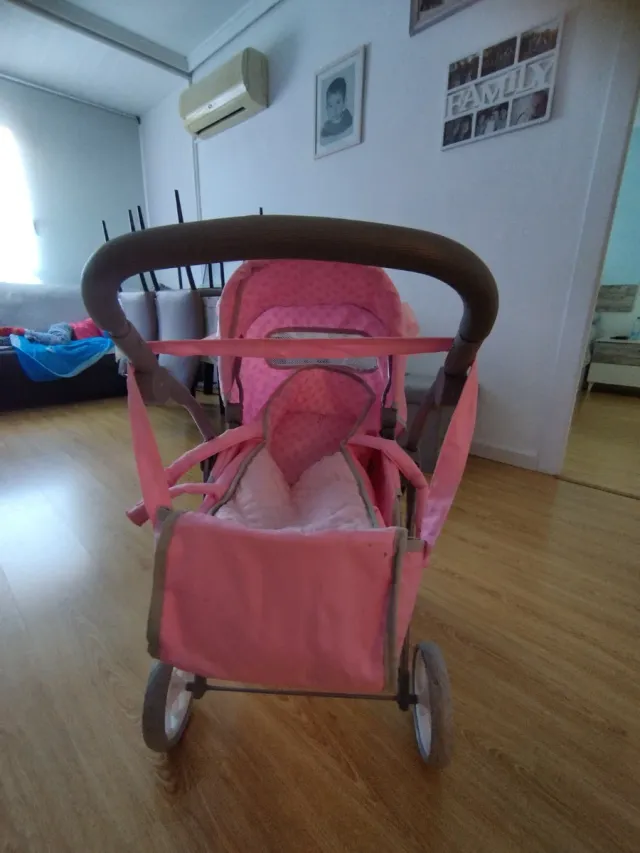 Carrito de paseo para muñecas rosa