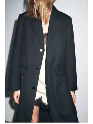 Americana larga negra a estrenar .