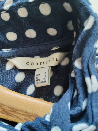 Mono azul de lunares blancos