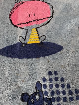Alfombra infantil azul con dibujos
