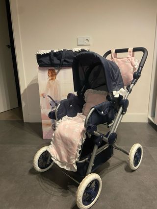 Cochecito de bebé rosa con estrellas