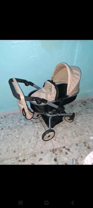 Carro de muñecas rosa y beige