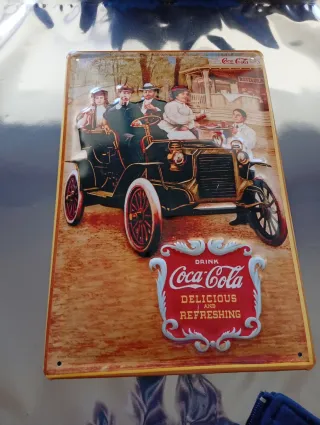 Cartelli pubblicitari in metallo Coca-Cola