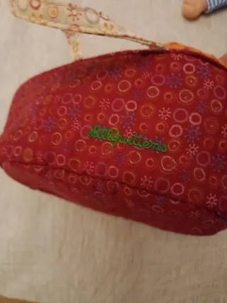 Muñeca bebé con cuco y pijama rayas