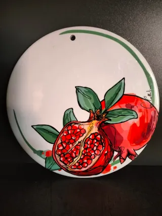 Sottopentola in ceramica e sughero con melograni.