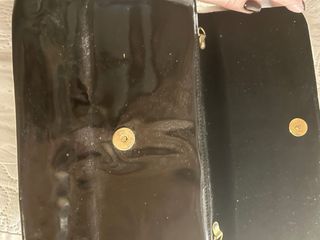 Pochette nera effetto pitone