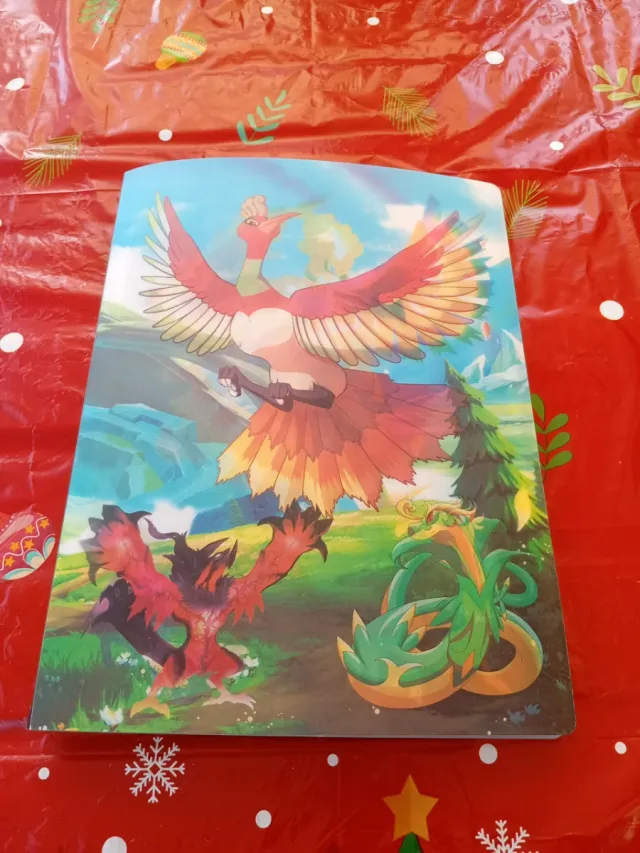 Álbum de Pokémon con arte de Ho-Oh y Lugia