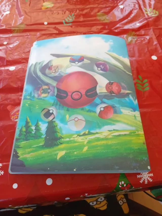 Álbum de Pokémon con arte de Ho-Oh y Lugia