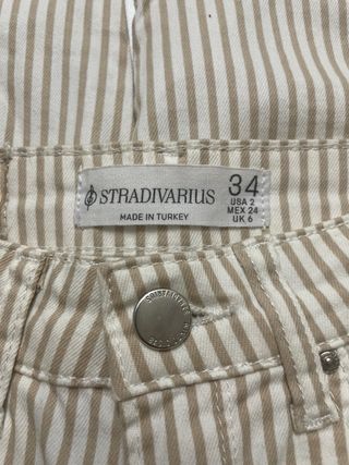 Pantalón pitillo rayas beige y marrón T.34