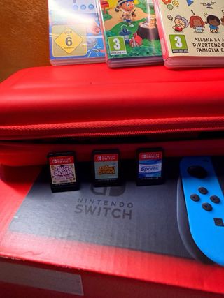 Nintendo Switch + 3 giochi + scatola accessori