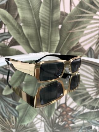 Occhiali da sole oro e neri