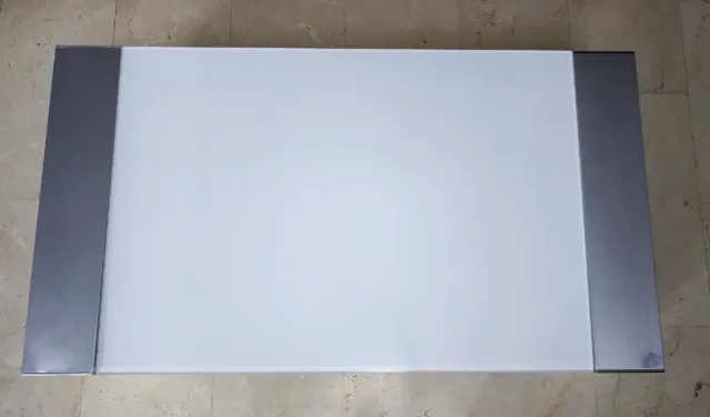 Tavolo rialzabile in vetro e acciaio