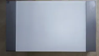 Tavolo rialzabile in vetro e acciaio