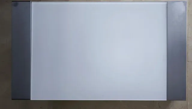 Tavolo rialzabile in vetro e acciaio