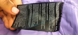 Chaqueta plumífero lila.