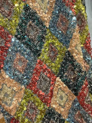 Poncho Uterqüe S. lentejuelas plumas