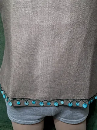 Blusa sin mangas con detalle turquesa Ideal coctel