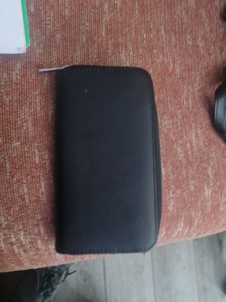 Cartera Stradivarius negra con flores ' c