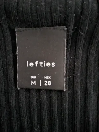 Jersey negro cuello alto manga 3/4