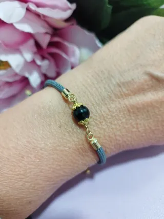 Braccialetto con su Coccu grigio e oro