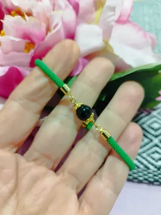 Braccialetto con su Coccu nero e cordino verde